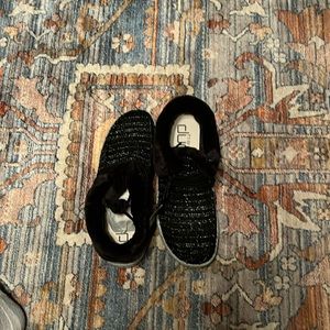 Black and grey sparkles with grey soles, fuzzy around the ankles, black laces